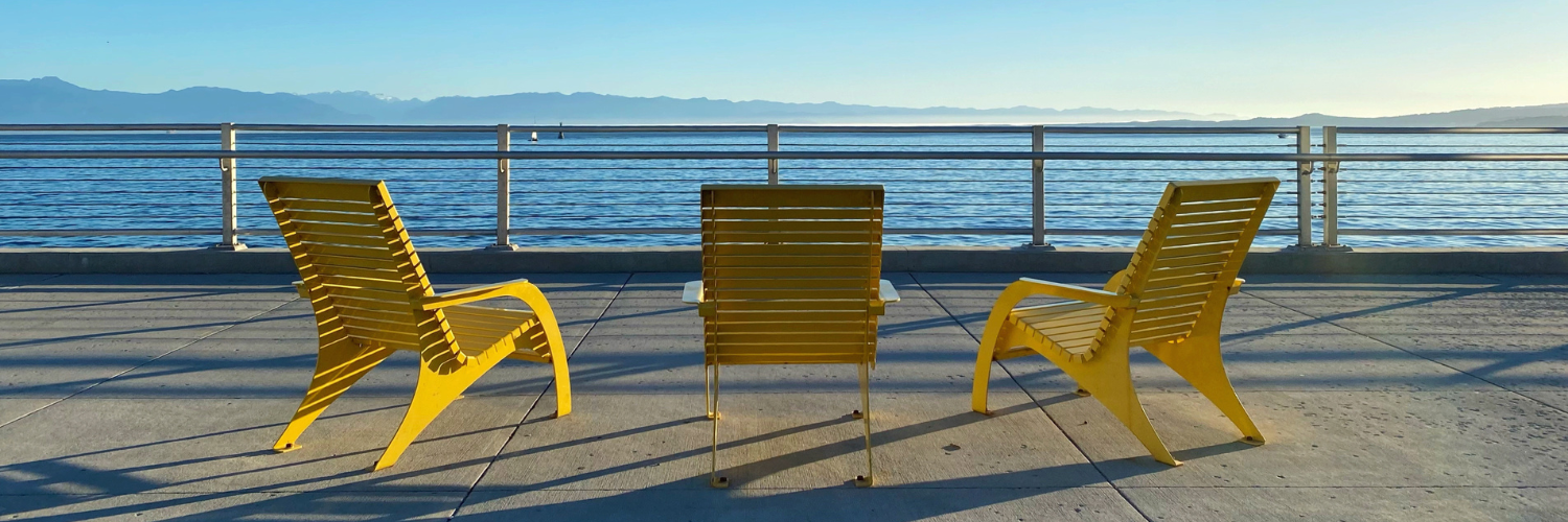 Three Yellow Chairs overlooking the ocean